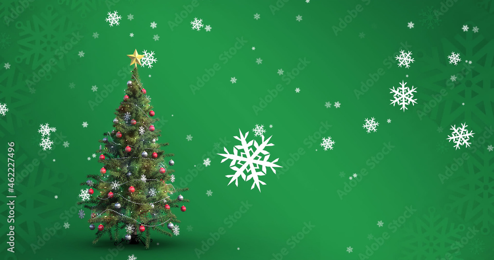 Image of falling snowflakes over christmas tree