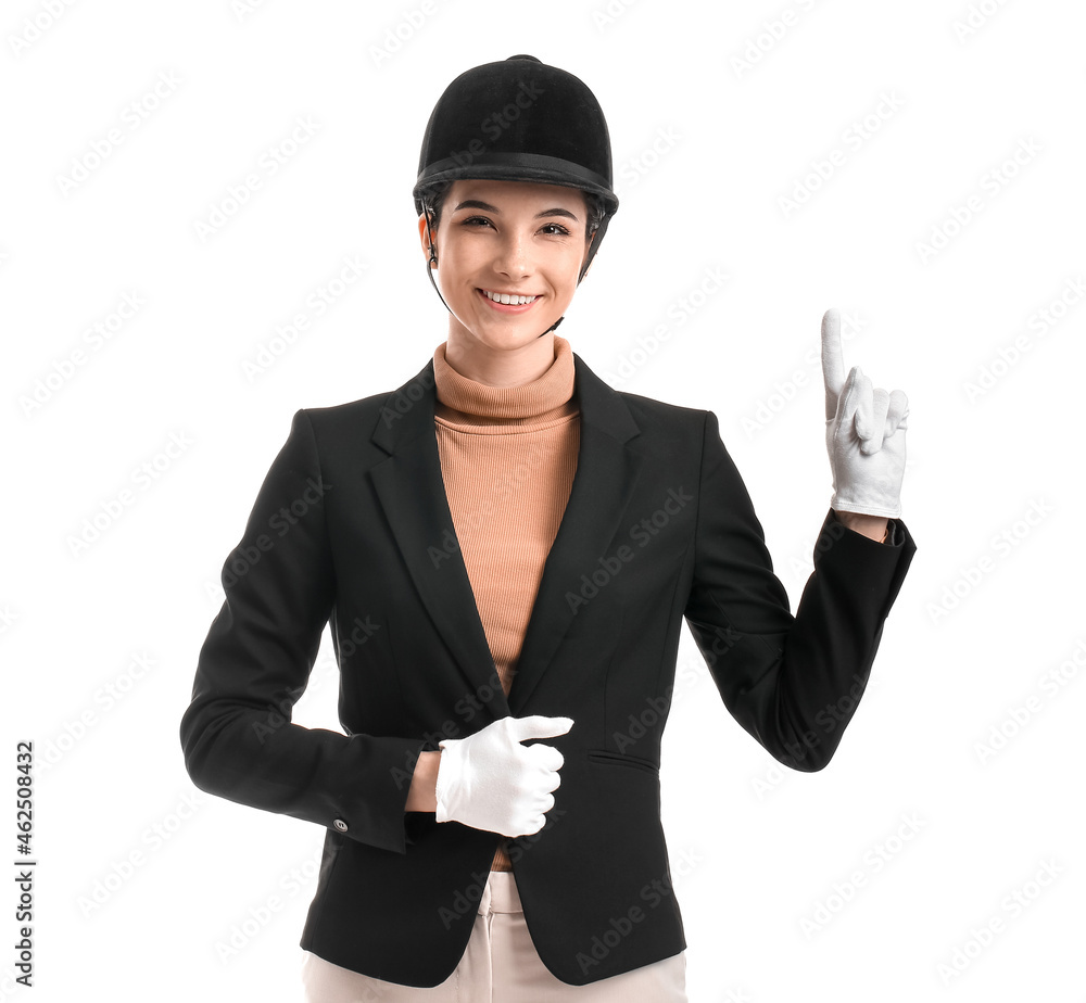 Beautiful female jockey showing something on white background