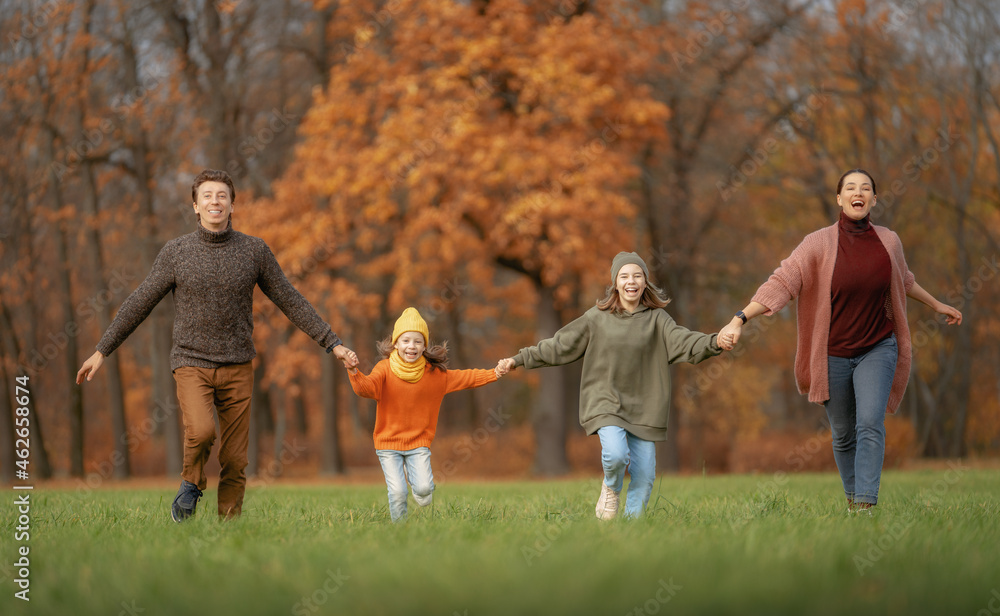 Happy family on autumn walk