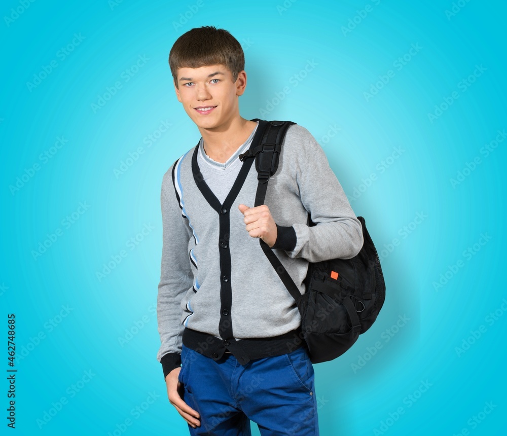 Young boy teen student wear casual clothes and backpack posing