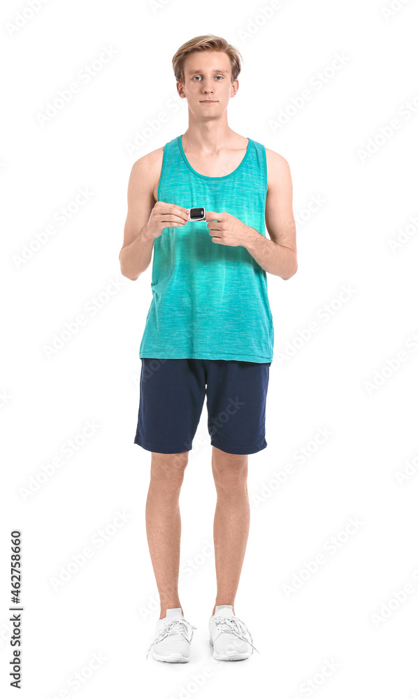 Sporty young man with pulse oximeter on white background