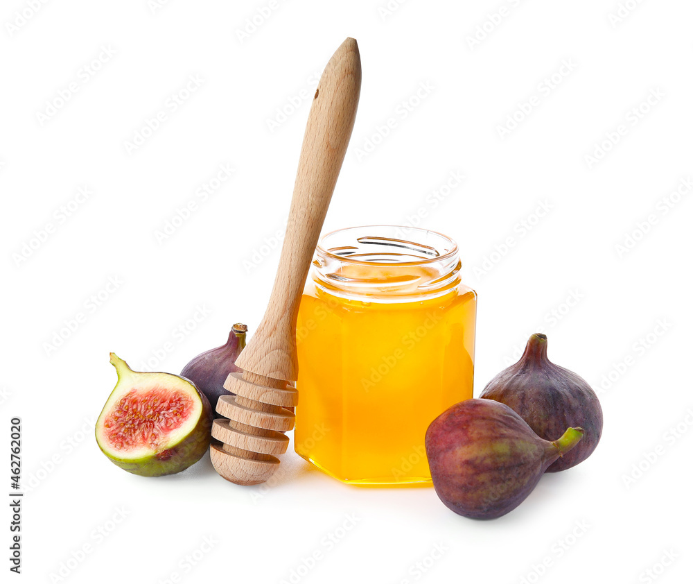 Glass jar with honey and fresh ripe figs on white background