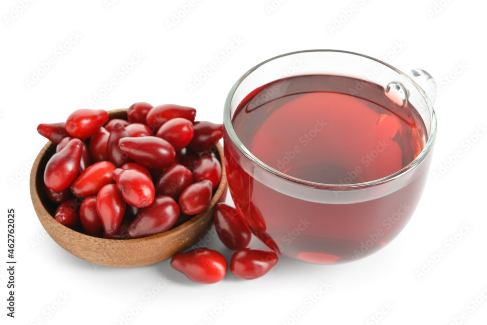 Cup of healthy dogwood berry drink on white background