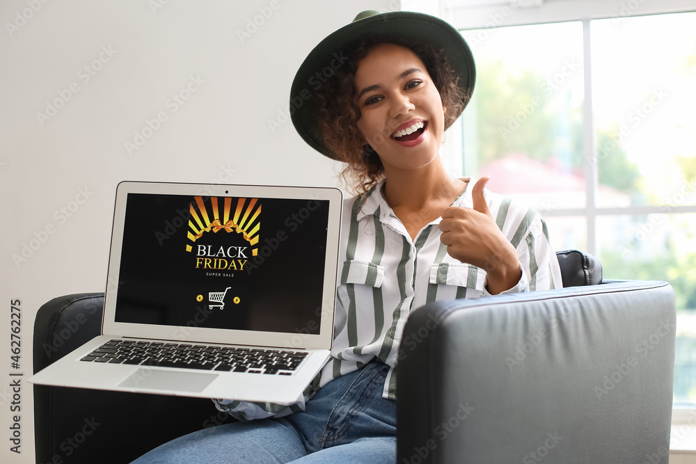 Young woman shopping online on Black Friday at home