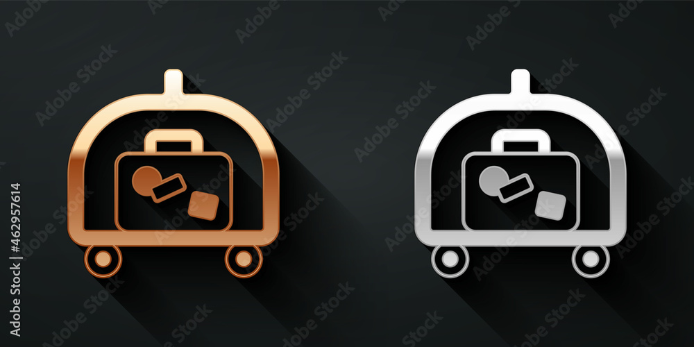 Gold and silver Hotel luggage cart with suitcase icon isolated on black background. Traveling baggag