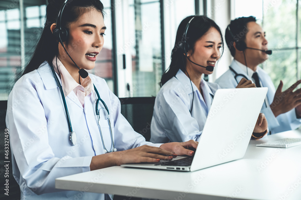 Doctor team wearing headset talking actively on video call in hospital clinic . Concept of telehealt