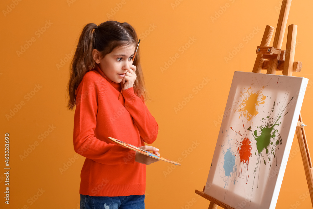 Surprised little painter on color background