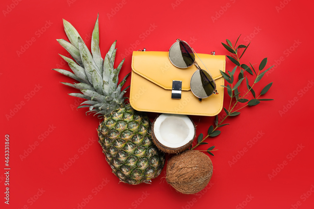 Composition with stylish bag, sunglasses and fruits on color background