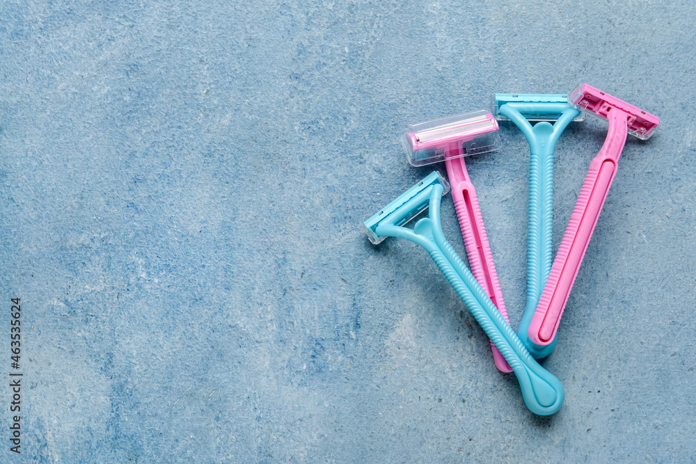 Different safety razors on color background