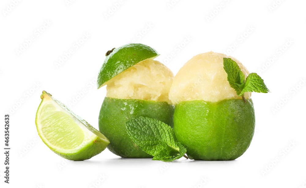 Tasty ice creams in lime peels on white background