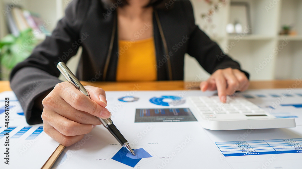 Close up of accountant or banker checking investment results, calculates financial savings, calculat