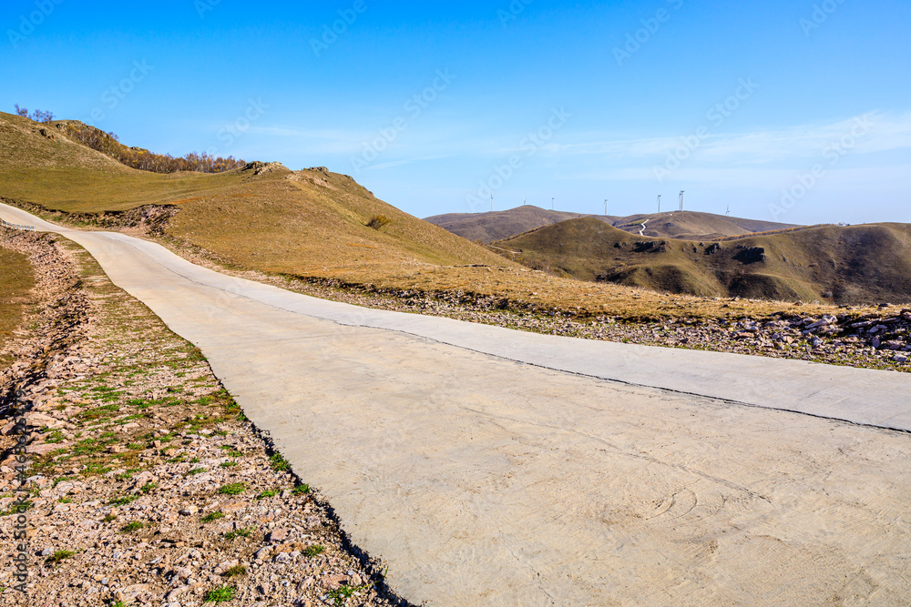 Curved road and mountain natural scenery in autumn season.Road and mountain background.