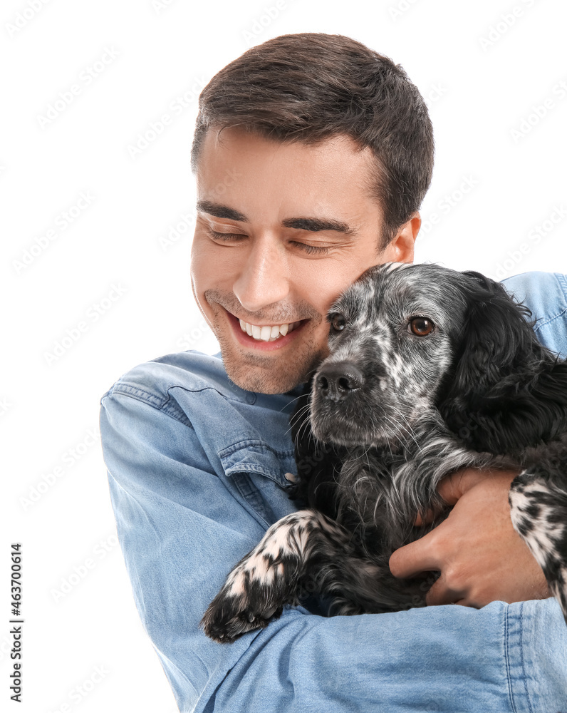 Happy young man with cute dog on white background