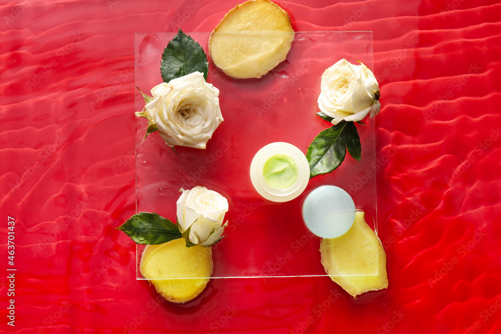 Jar of cream with flowers and pineapple in water on color background