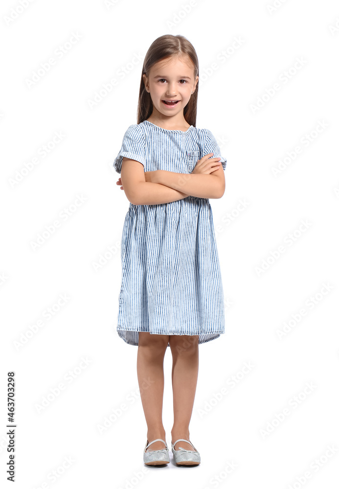 Cute little girl in striped dress on white background