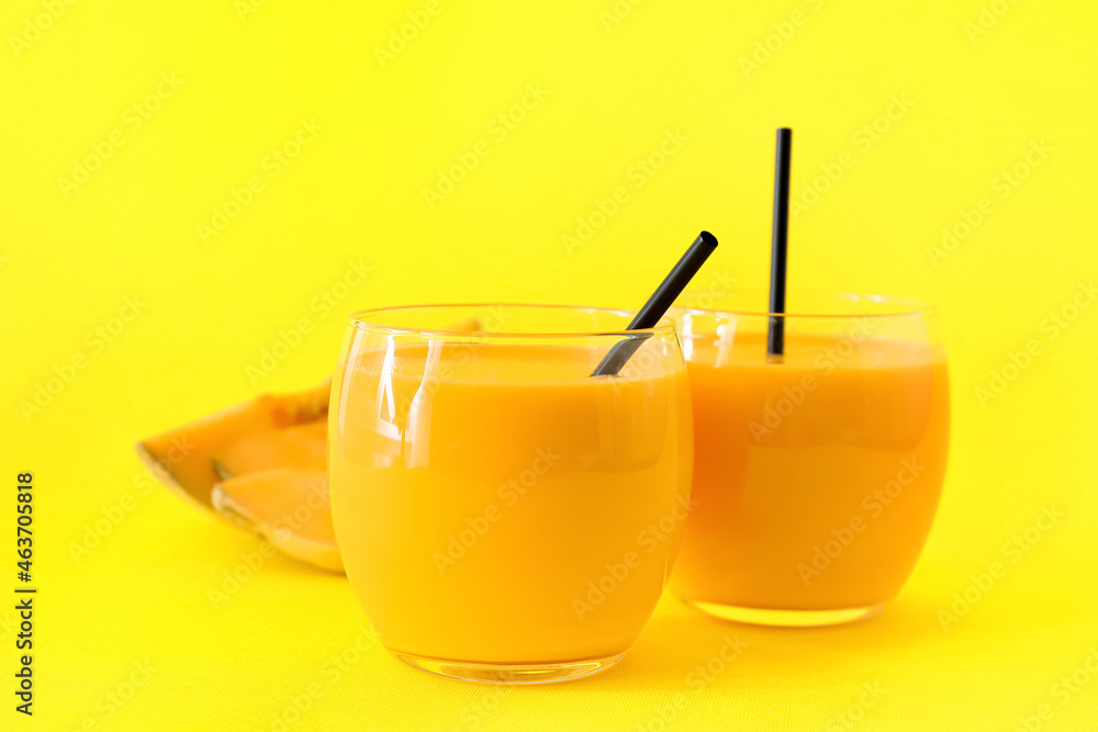 Glasses of tasty melon milkshake on color background, closeup