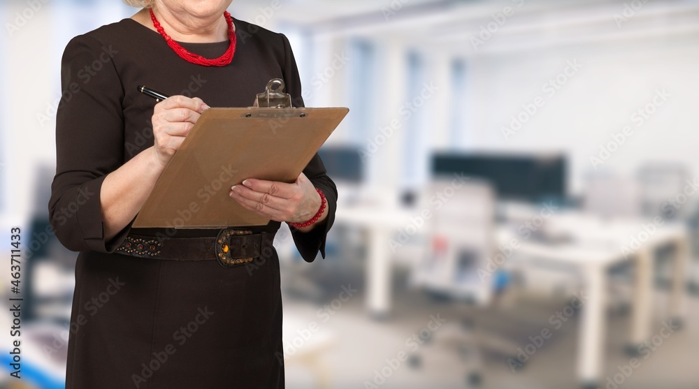 Disabled woman filling out an application for employment in office