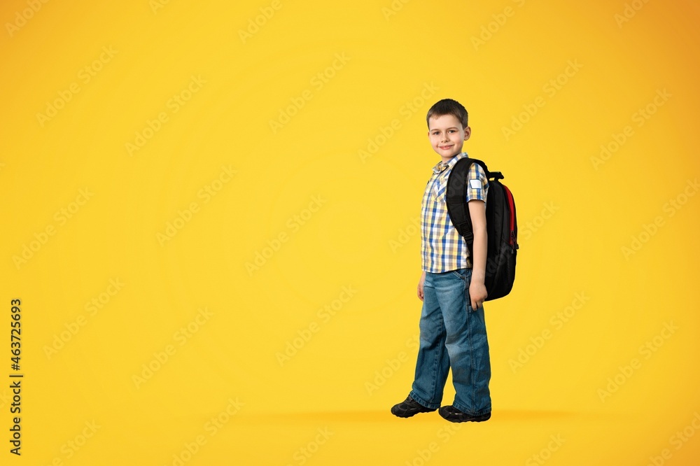 Cute little boy go wear bag and uniform on the background