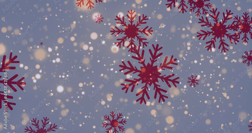 Image of spots of lights over falling red snowflakes