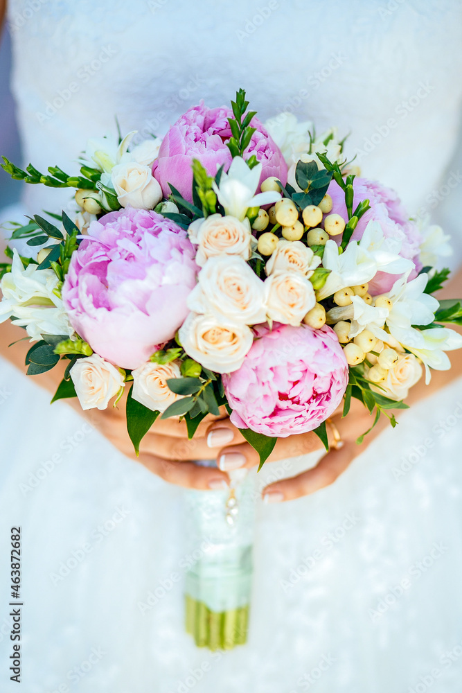 Bride holding bouguet of flowers