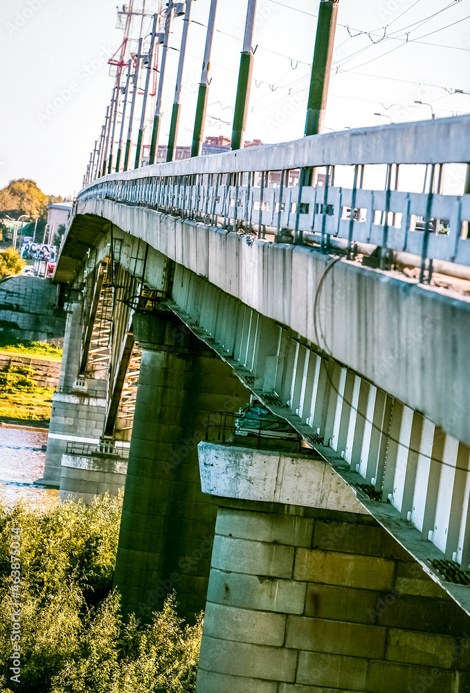 concrete bridge over the river industrial landscape close up