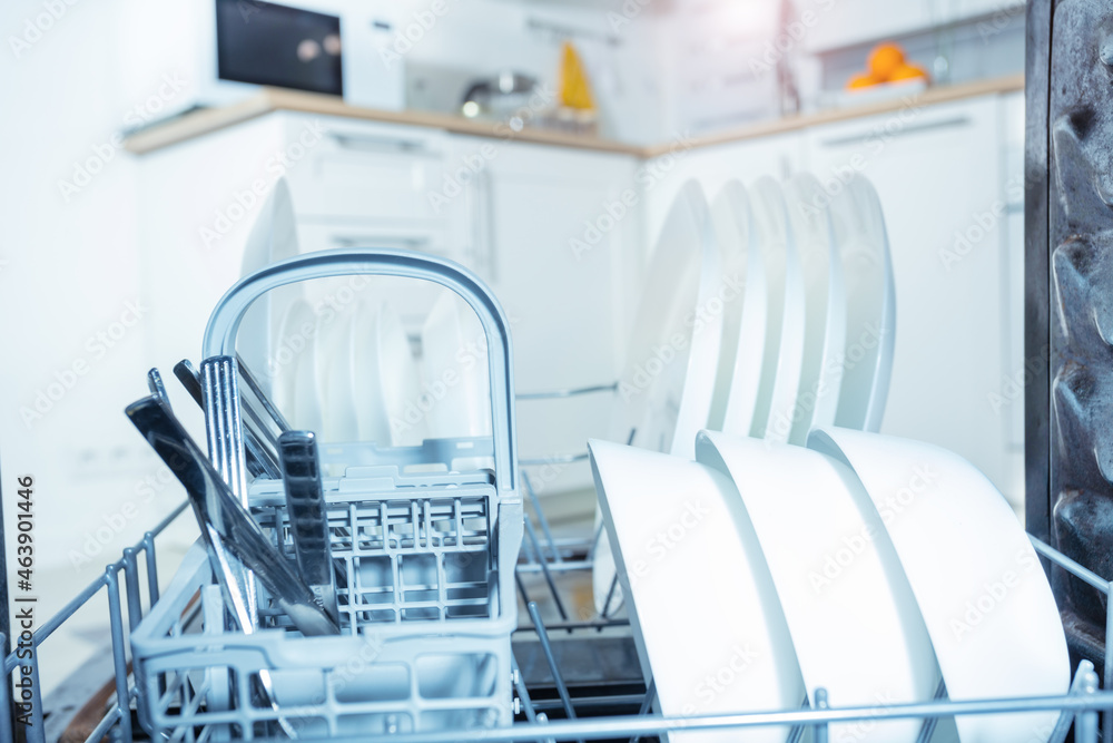 Plates dishes and silverware inside the dishwasher