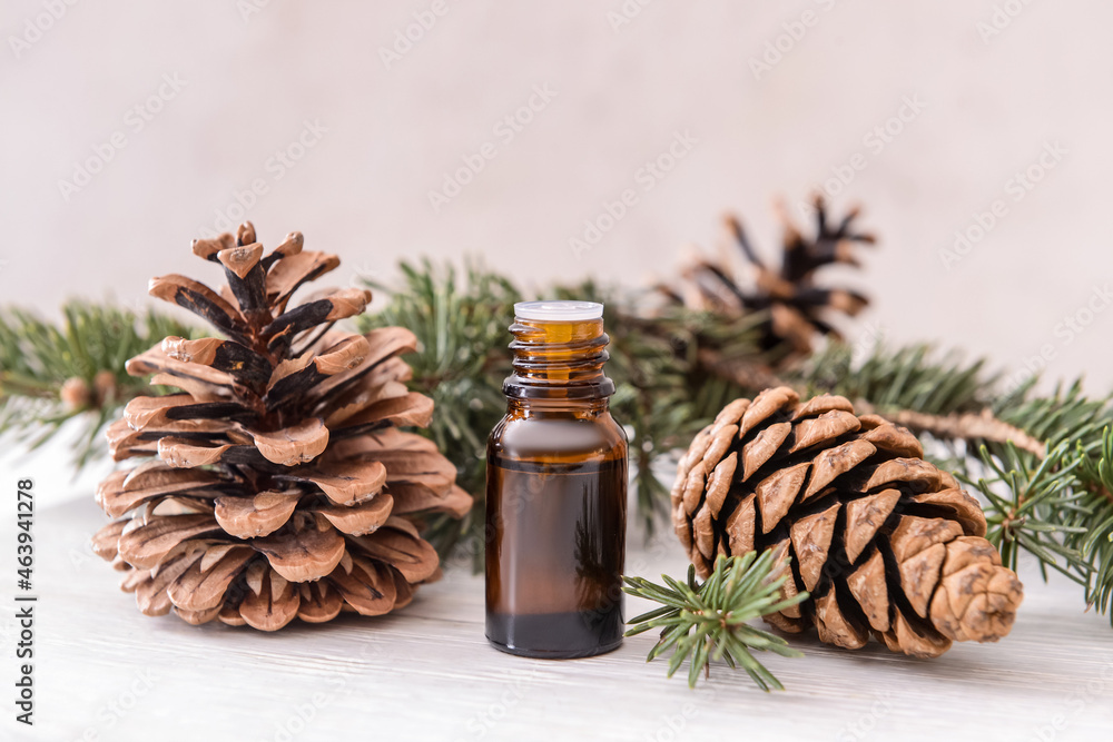 Bottle of coniferous essential oil on table