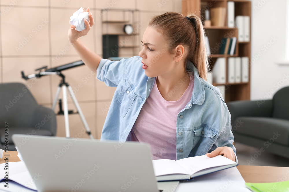 Female student preparing for exam at home