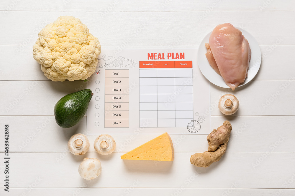 Meal plan and healthy products on light wooden background