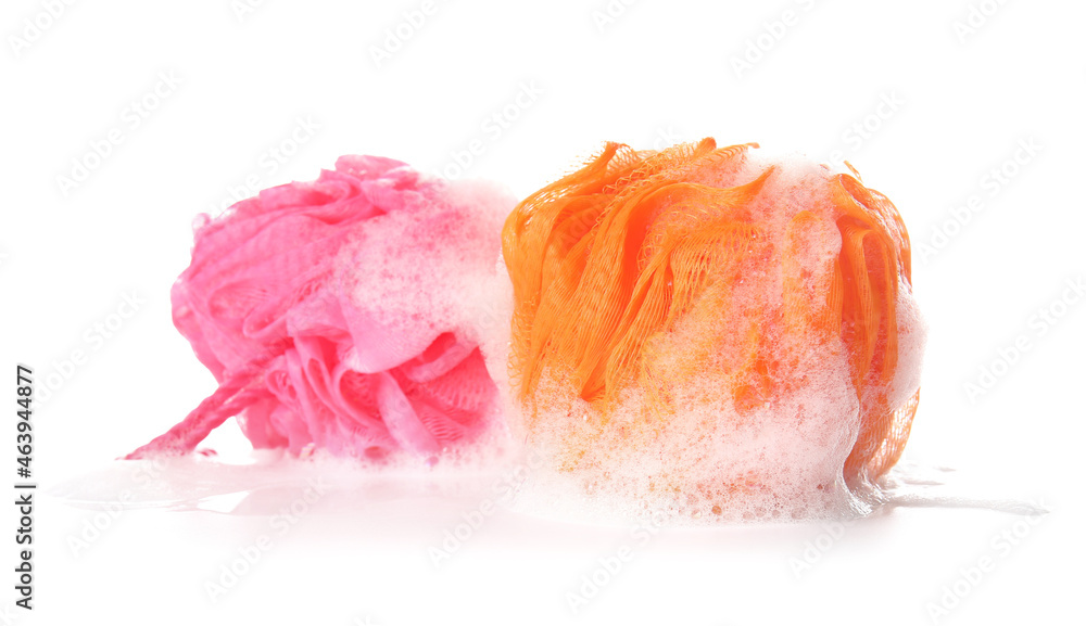 Bath sponges with foam on white background