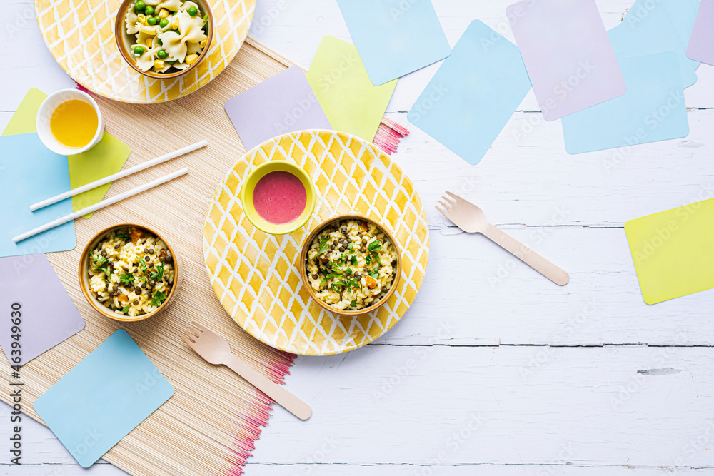 Pumpkin risotto kids food background, with green lentils