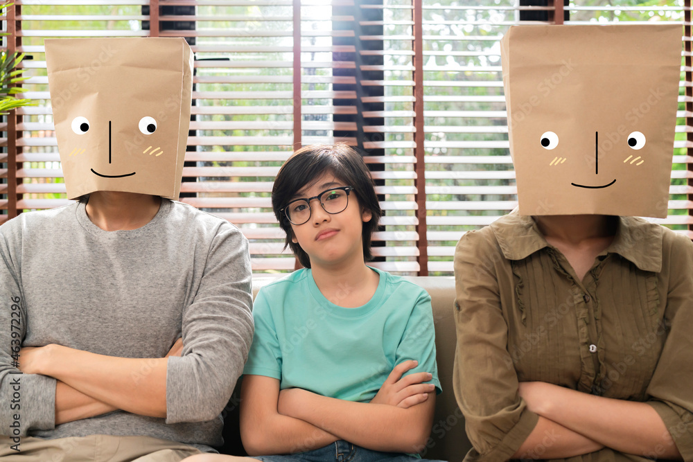 naughty son feeling stress with dad mom wearing paper bag with smiling drawing face emotion sit toge