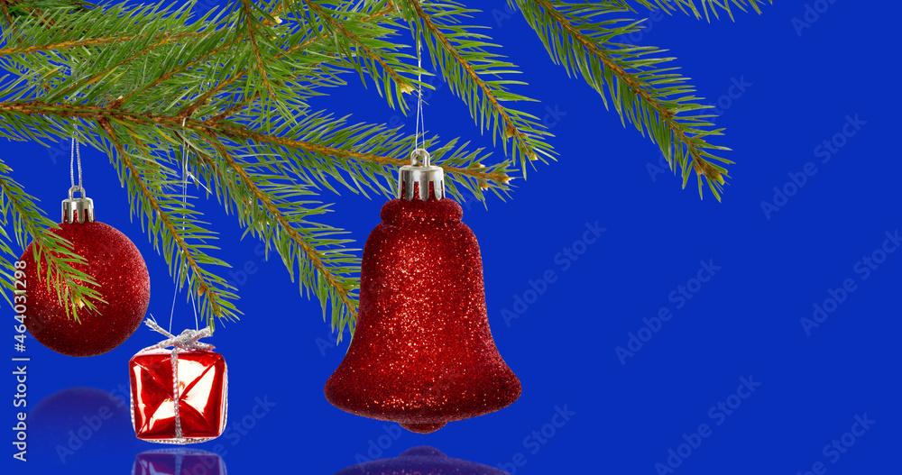 Image of christmas tree decorations over blue background