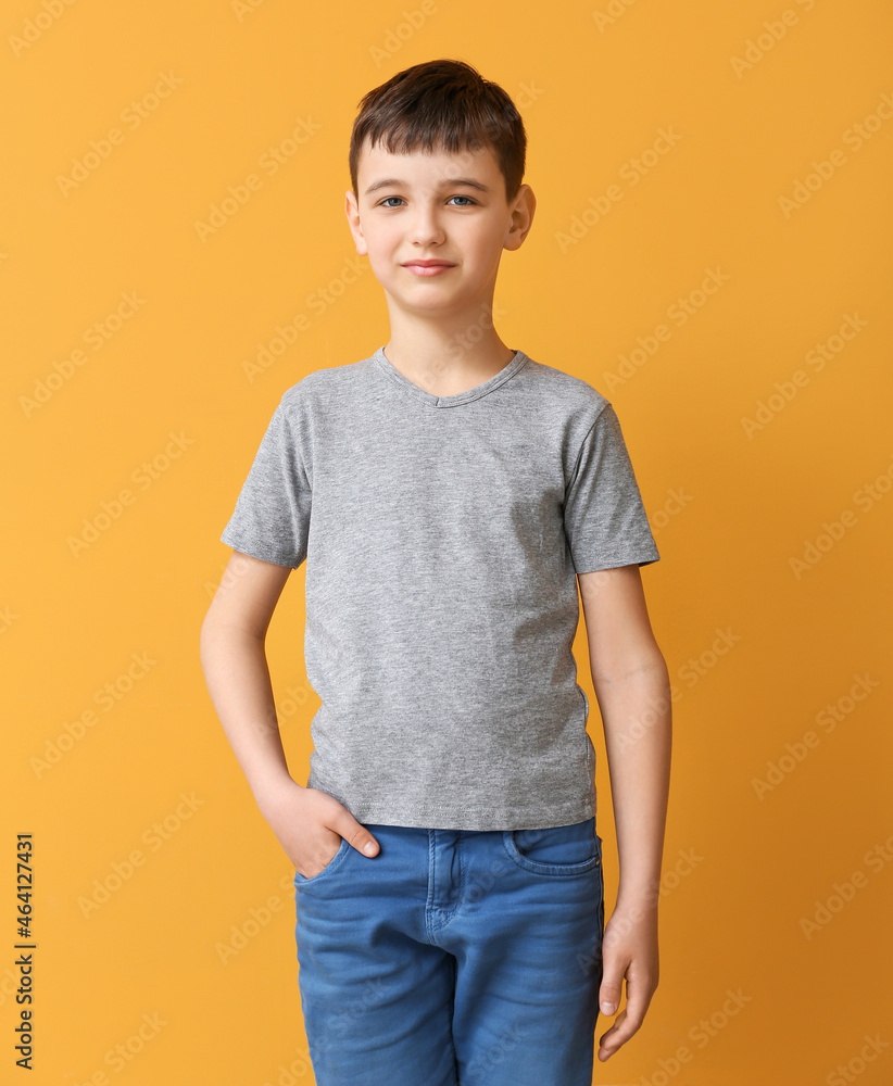 Little boy in stylish t-shirt on color background