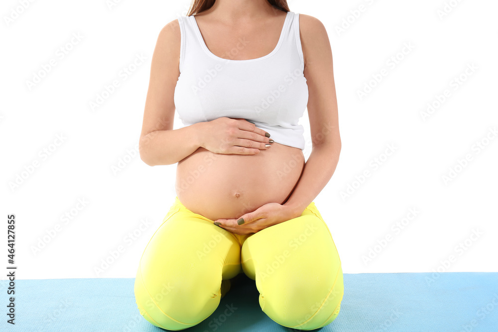 Young pregnant woman doing yoga on white background, closeup