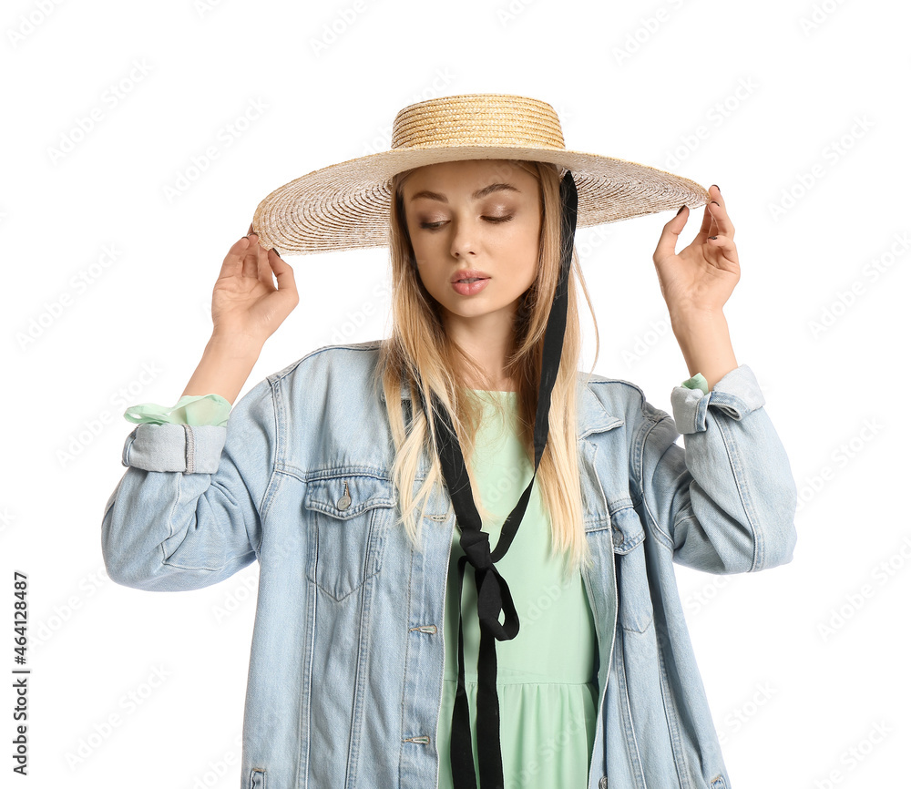 Woman wearing wicker hat on white background