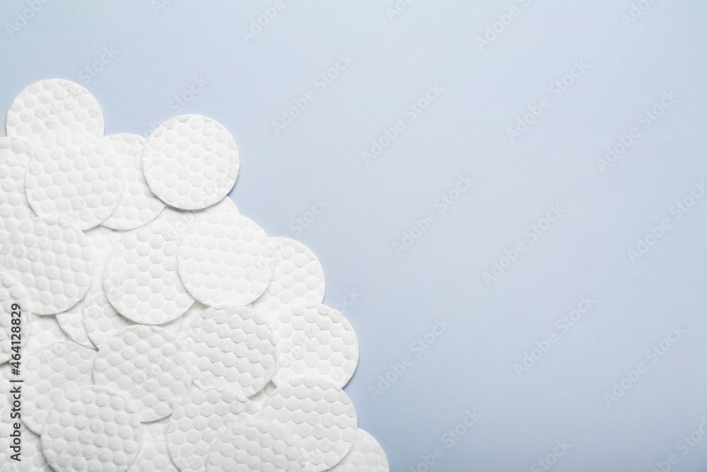 Clean cotton pads on color background