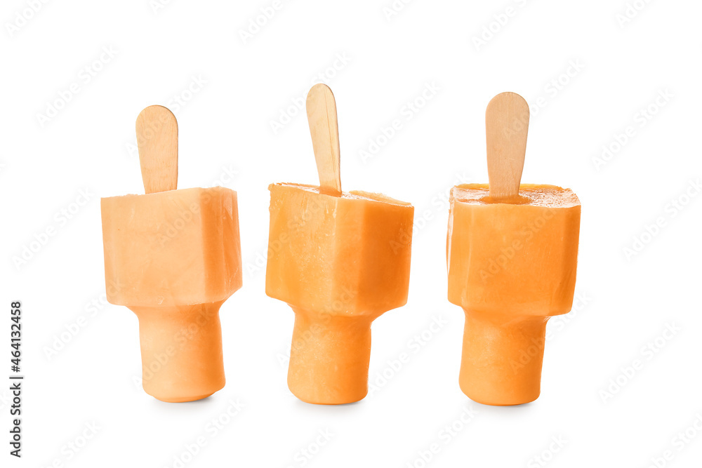 Tasty melon popsicles on white background