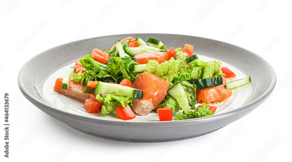 Tasty salad with salmon and vegetables in plate on white background