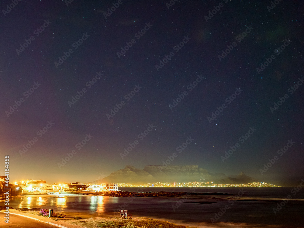 Night view of Table Mountain viewed from Big Bay Blouberg Cape Town, Western Cape, South Africa.