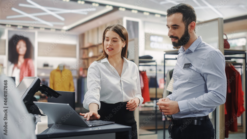 Clothing Store: Businesswoman Uses Laptop Computer, Talks to Visual Merchandising Specialist, Collab