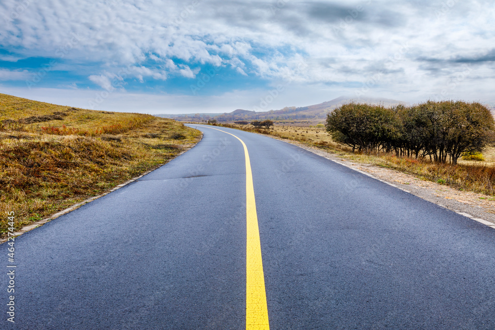 Empty asphalt road pavement and sky clouds on a cloudy day.Road ground scene after rain.