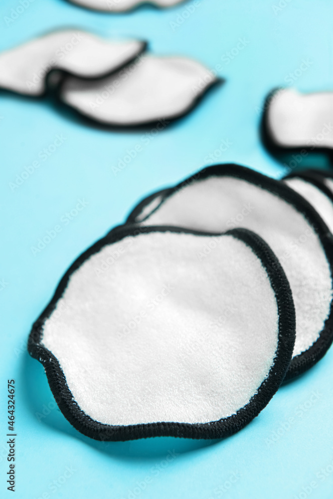 Reusable cotton pads on blue background