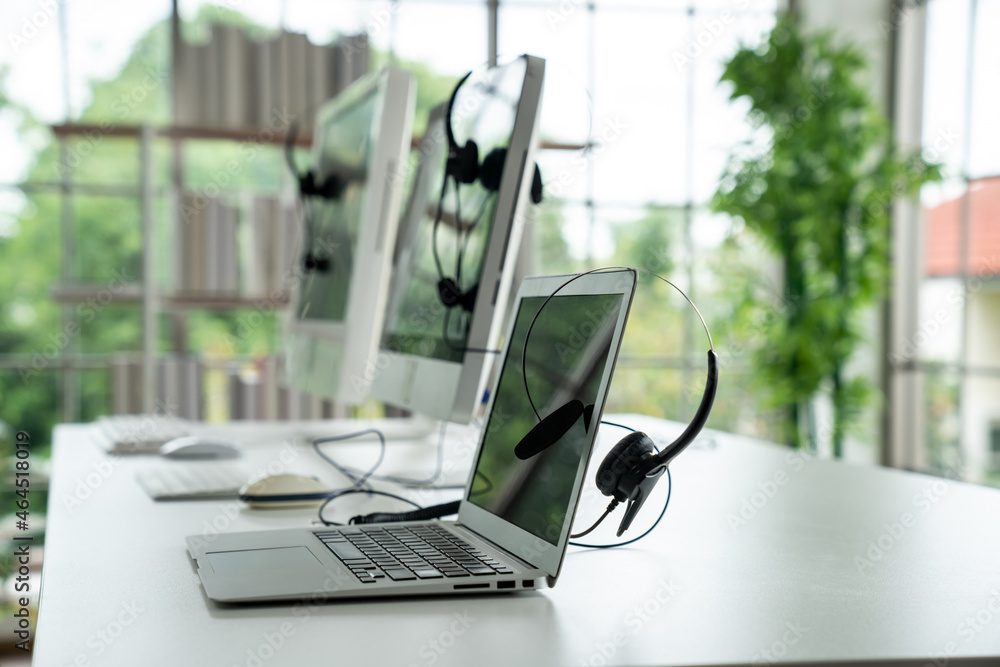 Headset and customer support equipment at call center ready for actively service . Corporate busines