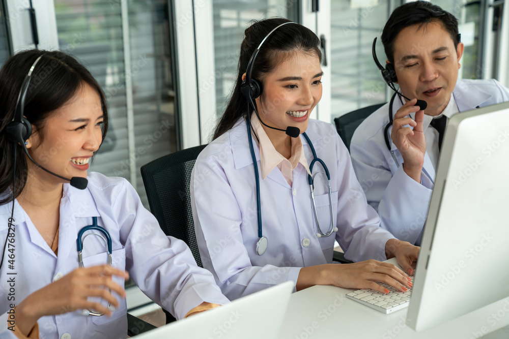 Doctor team wearing headset talking actively on video call in hospital clinic . Concept of telehealt