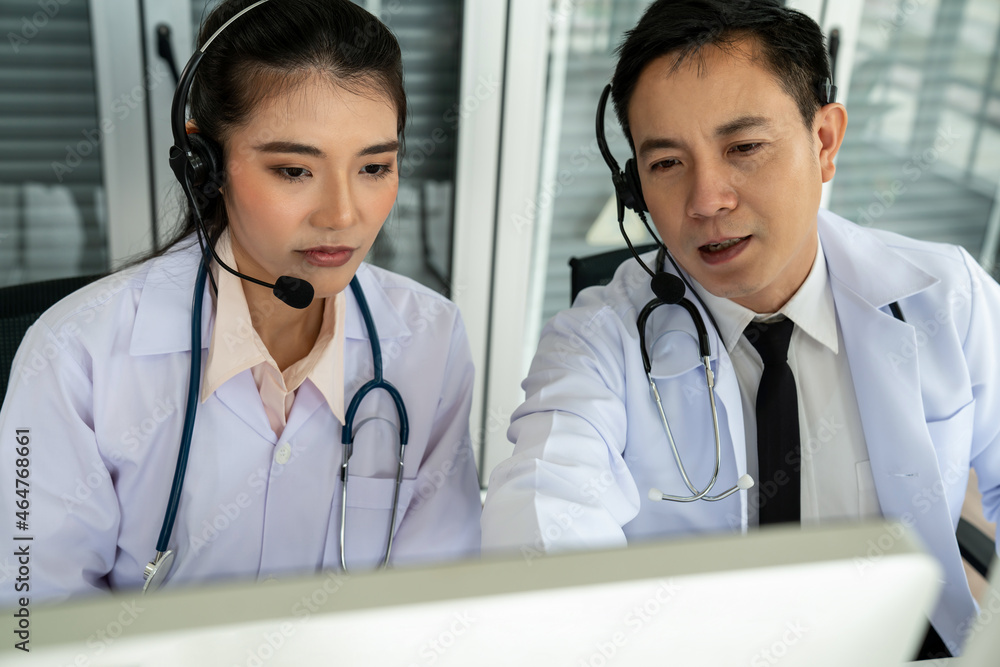 Doctor team wearing headset talking actively on video call in hospital clinic . Concept of telehealt