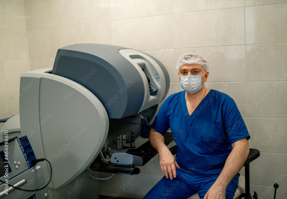 Handsome professional surgeon in medical mask. Medicine specialist in special uniform.