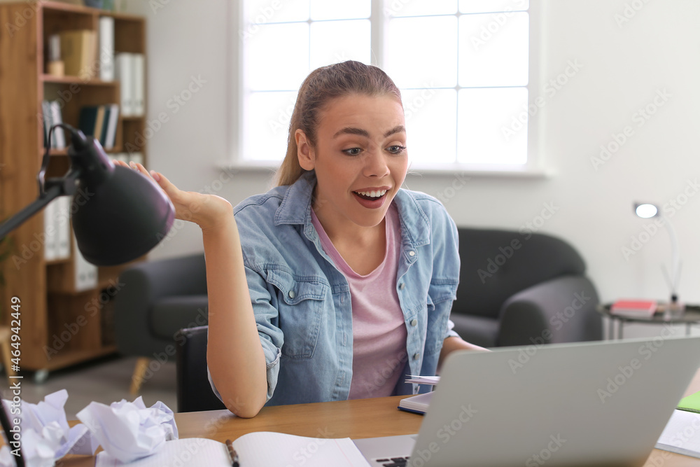 Female student preparing for exam at home