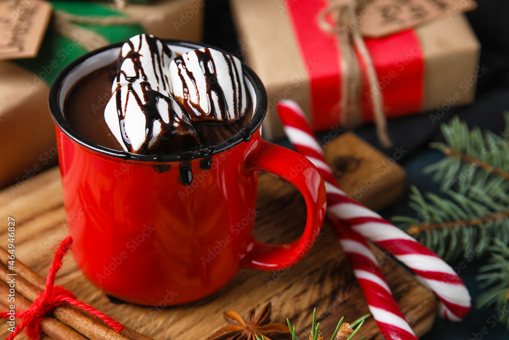 Mug of delicious hot chocolate on table