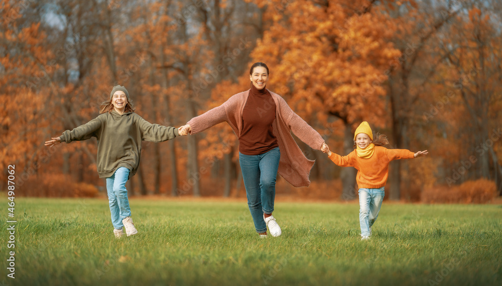 Happy family on autumn walk